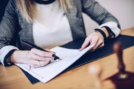 woman eigning paper