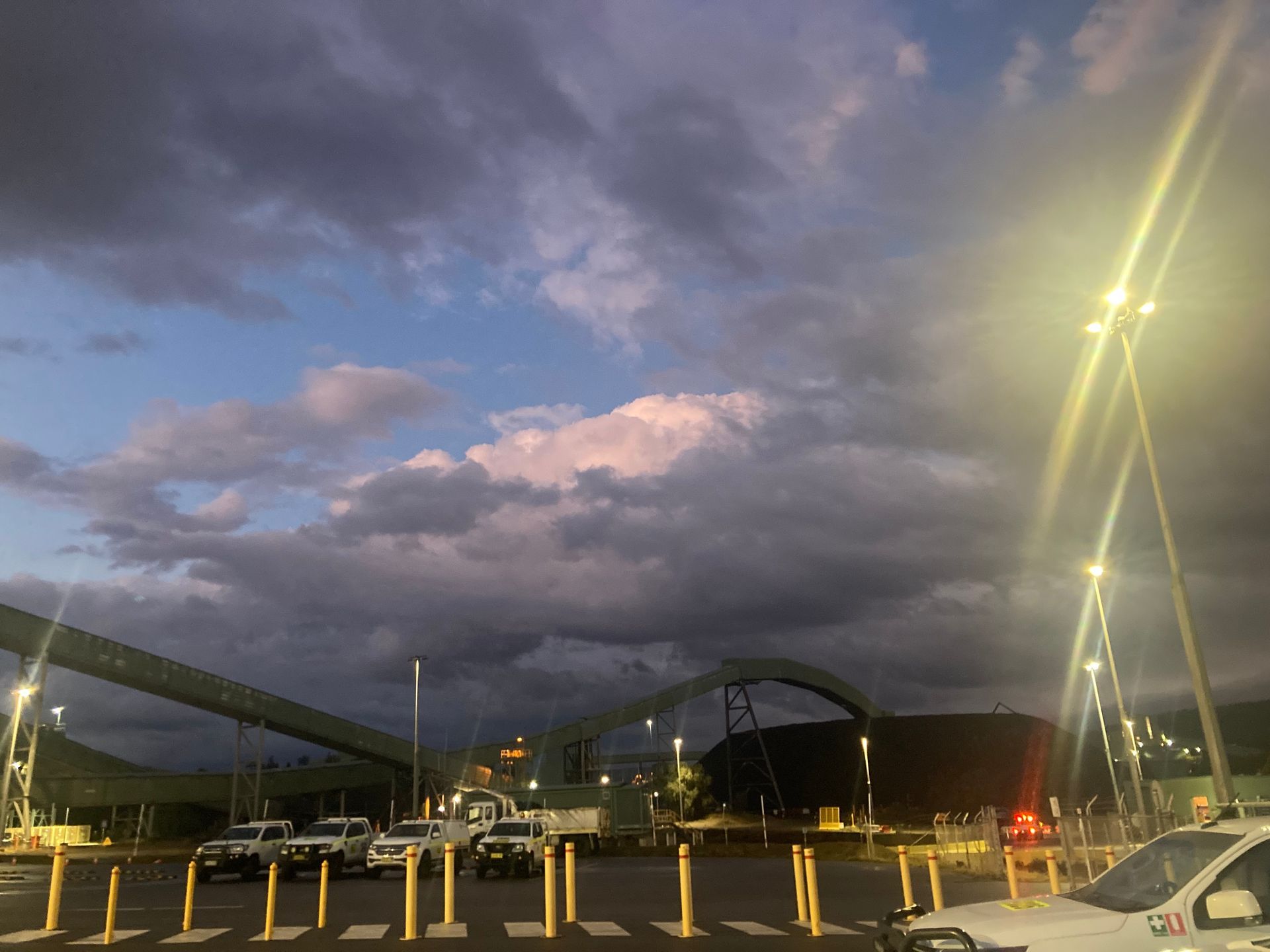 A Lot Of Cars Are Parked In A Parking Lot Under A Cloudy Sky — JMG Maintenance & Fabrication In Muswellbrook NSW