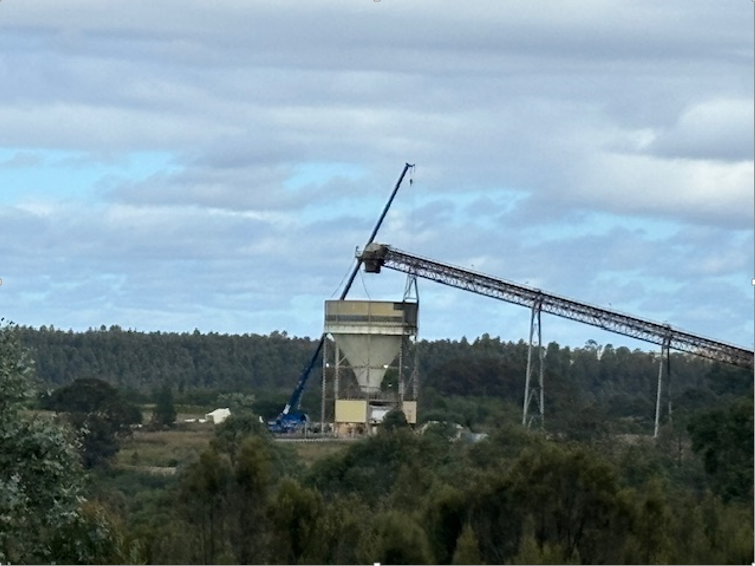 A large building with a crane on top of it