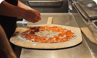 chef making pizza