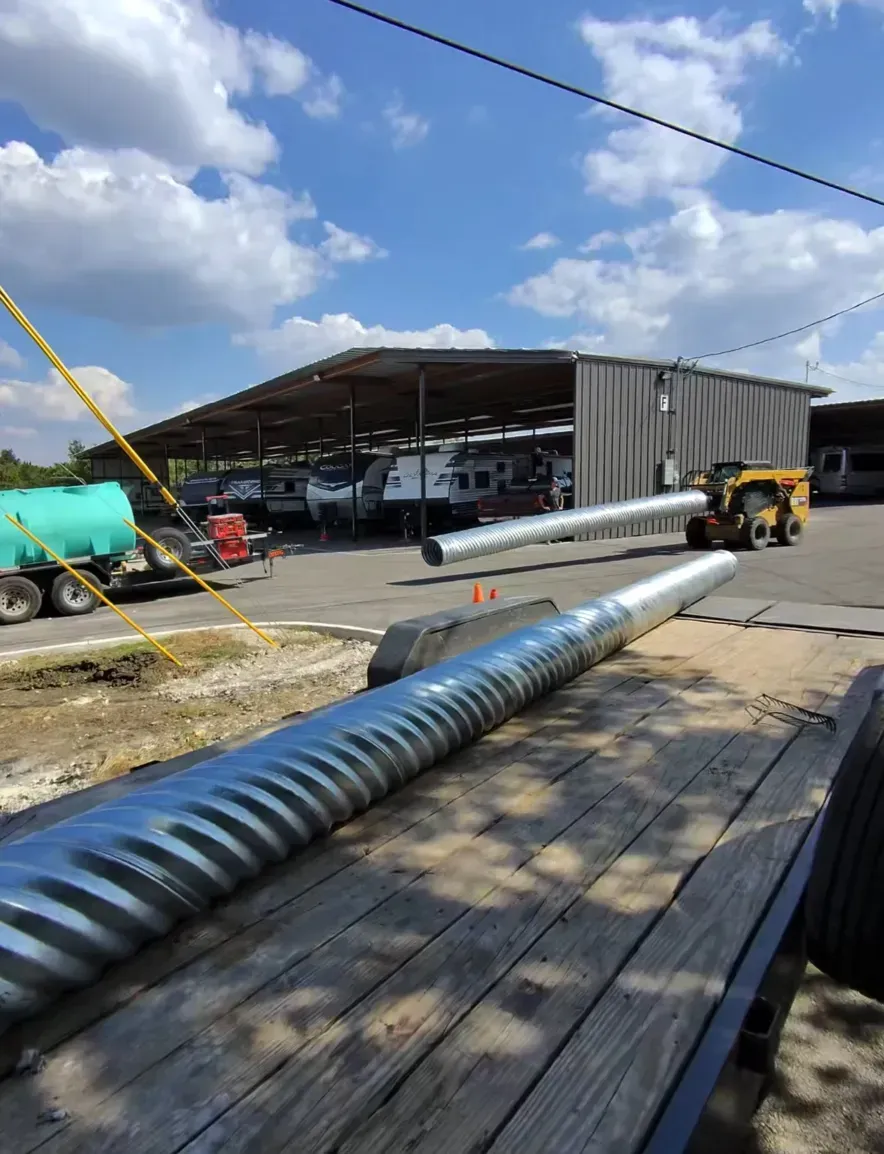 Gray steel beams forming the framework of a building roof or ceiling.