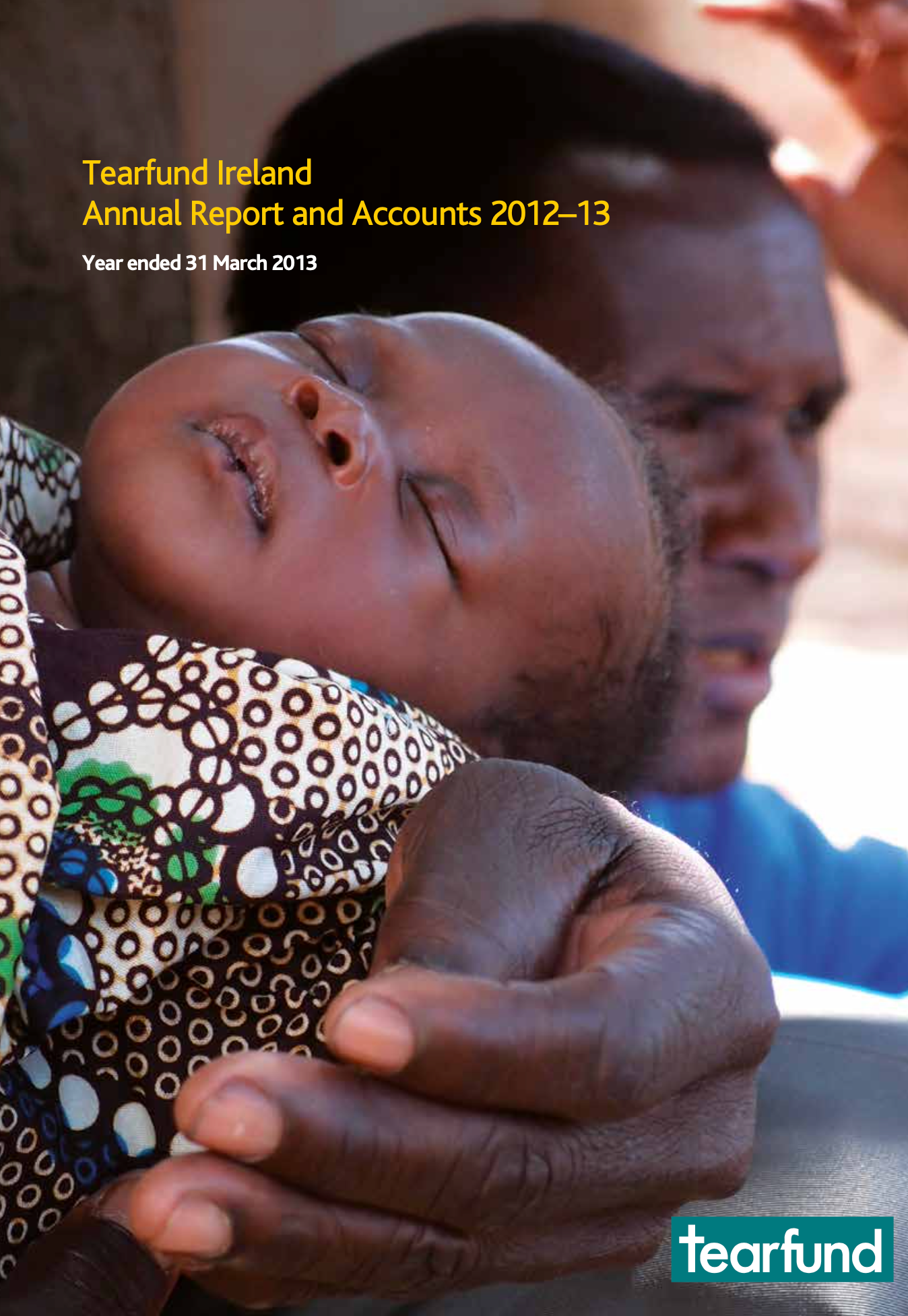 Tearfund Ireland annual report cover: dark-skinned baby held by a dark-skinned person, text at top, Tearfund logo at the bottom.