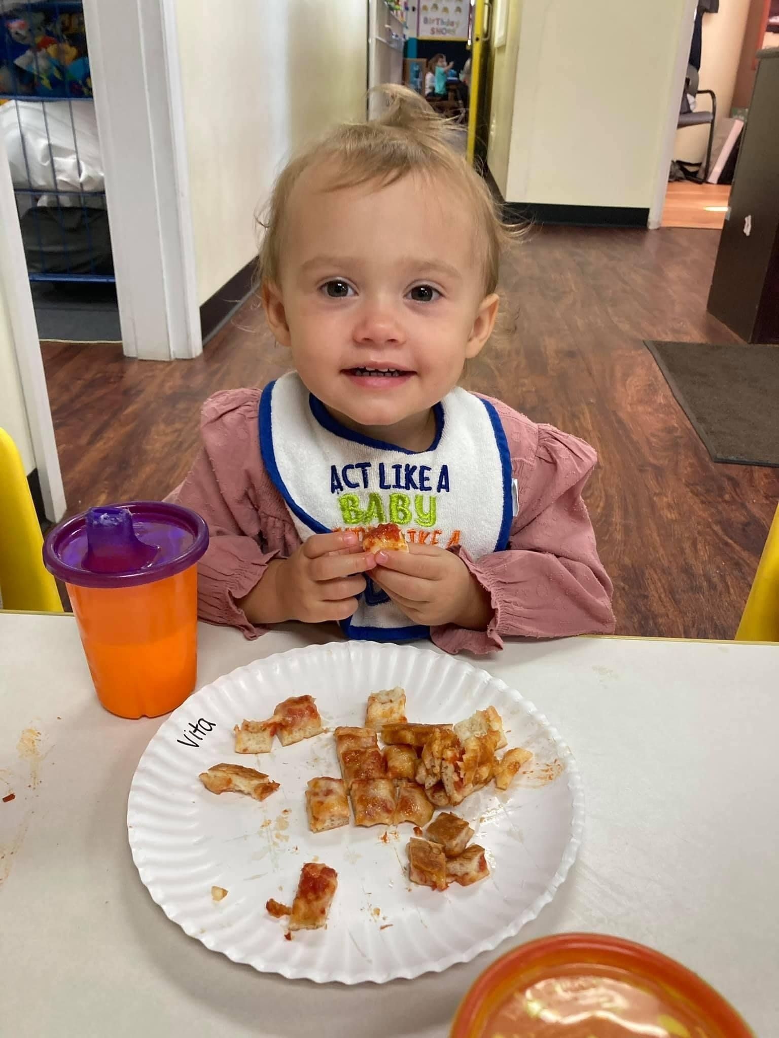 small child eating lunch