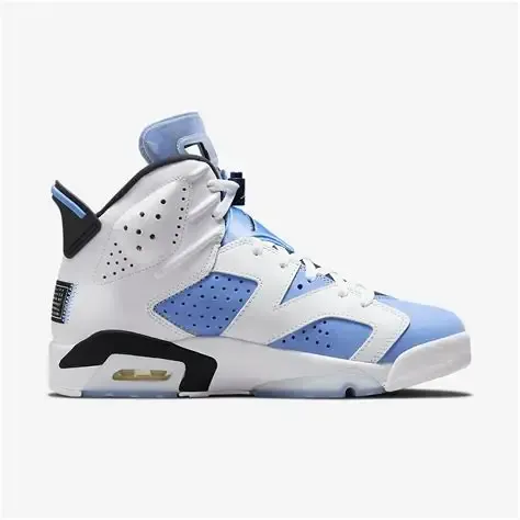 White and light blue Air Jordan 6 sneaker. Black and gold accents.