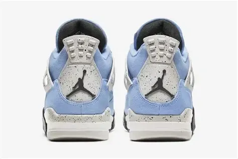 Light blue and gray Air Jordan 4 sneakers with black and white accents.