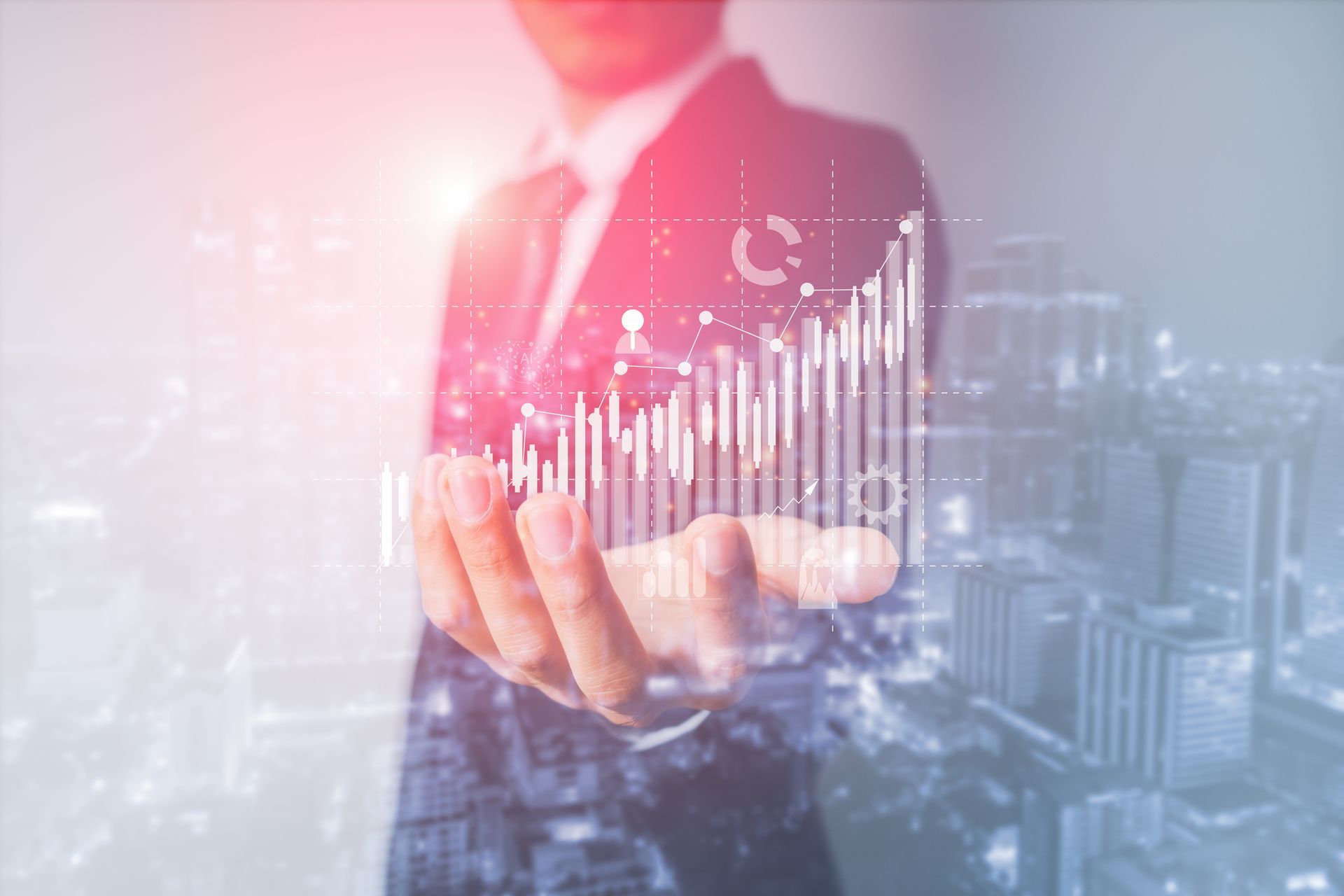 Businessperson holding holographic rising bar chart over cityscape background.