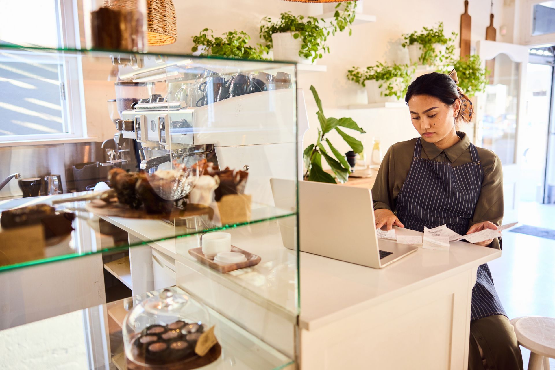 Woman managing accounts and organising receipts for a professional business accounting service. Woman managing accounts and organising receipts for a professional business accounting service.