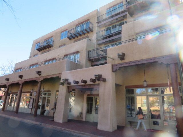 A large building with a lot of windows and balconies