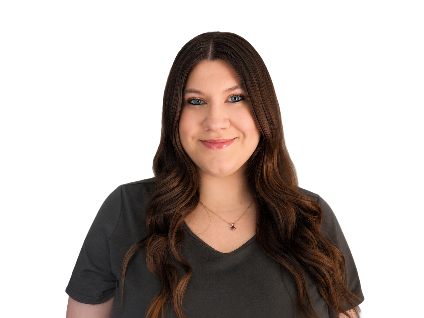 Smiling woman with long dark hair wearing a dark gray V-neck shirt against a white background