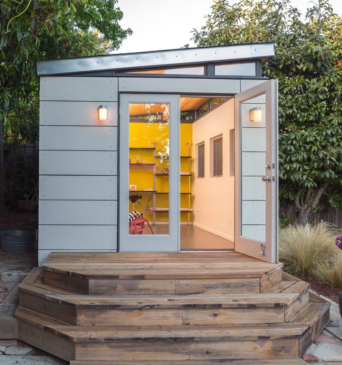 A small shed with a staircase leading up to it