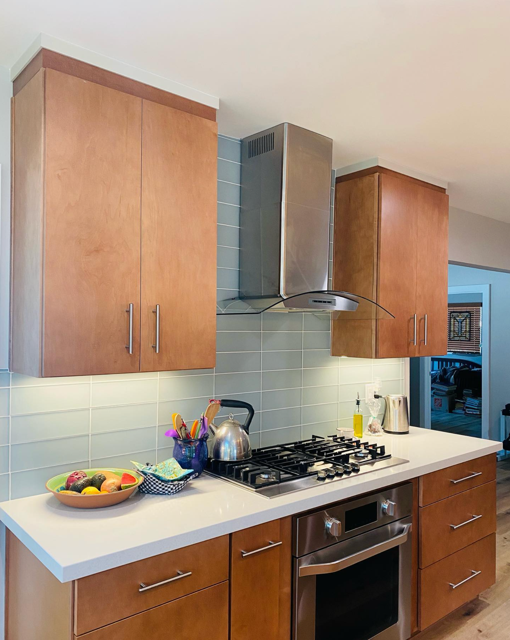 A kitchen with wooden cabinets and stainless steel appliances