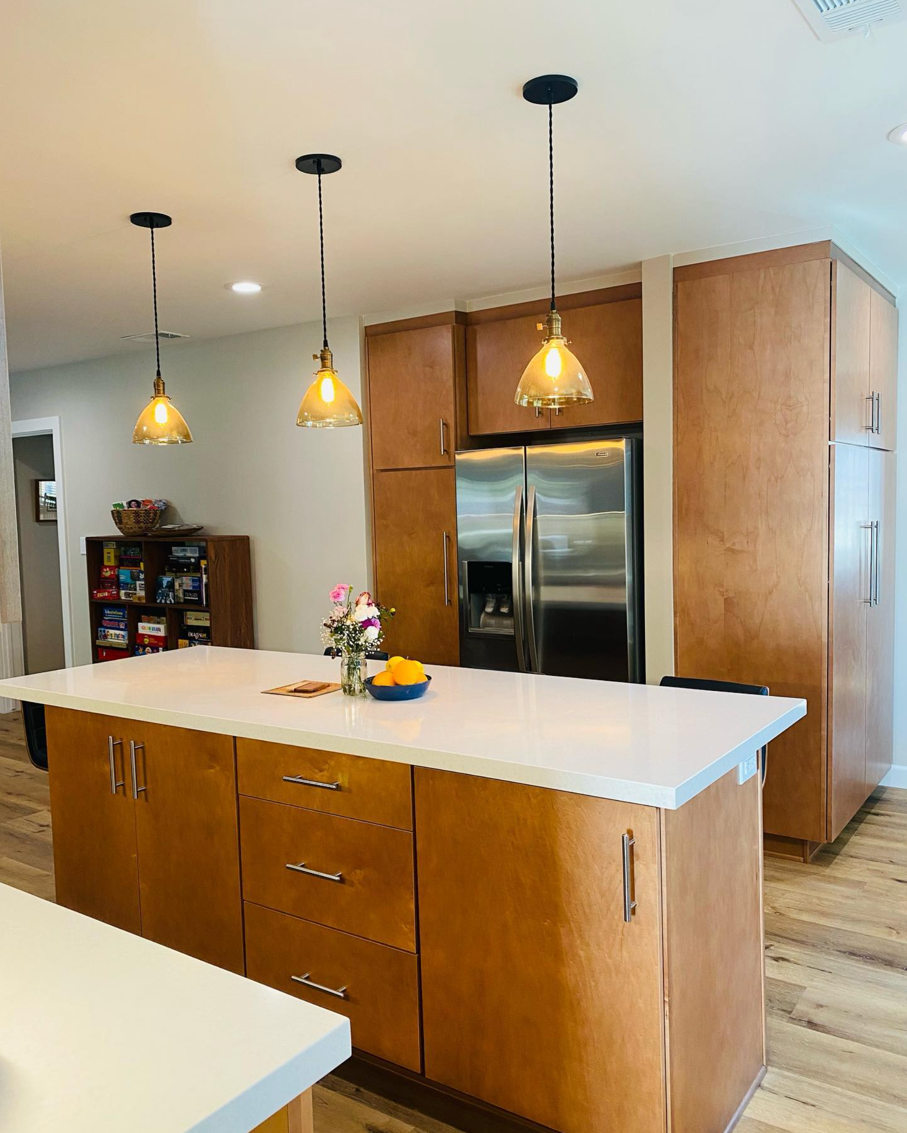 A kitchen with stainless steel appliances and wooden cabinets