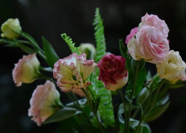 Soft pink and white flowers arranged with greenery for cremation services in Port Washington, WI.