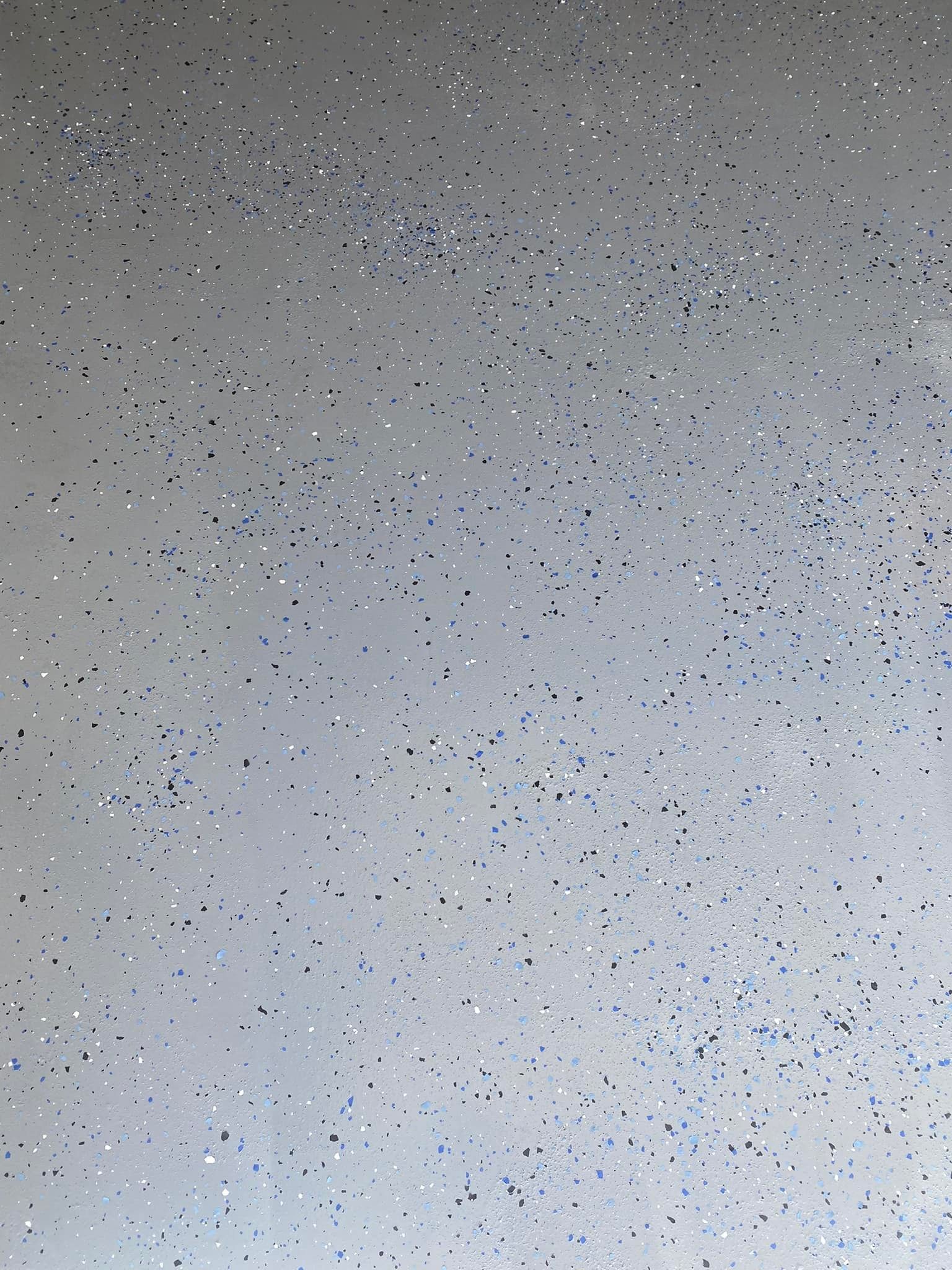 White background speckled with shimmering silver and blue glitter.