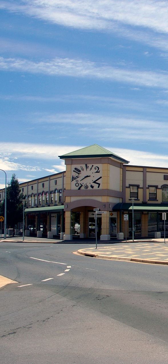 A large building with a clock on the top of it