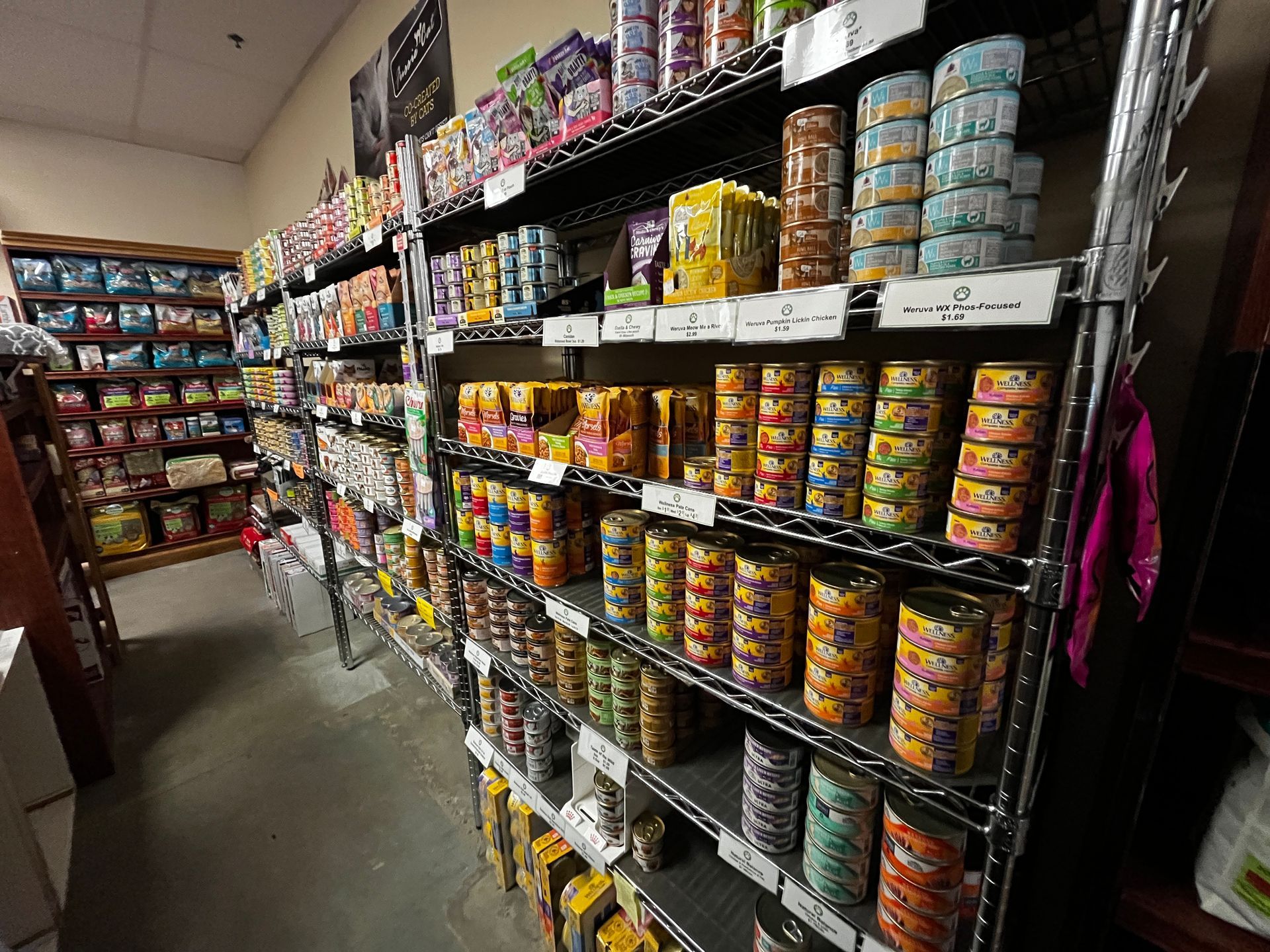 A store filled with shelves filled with canned food.
