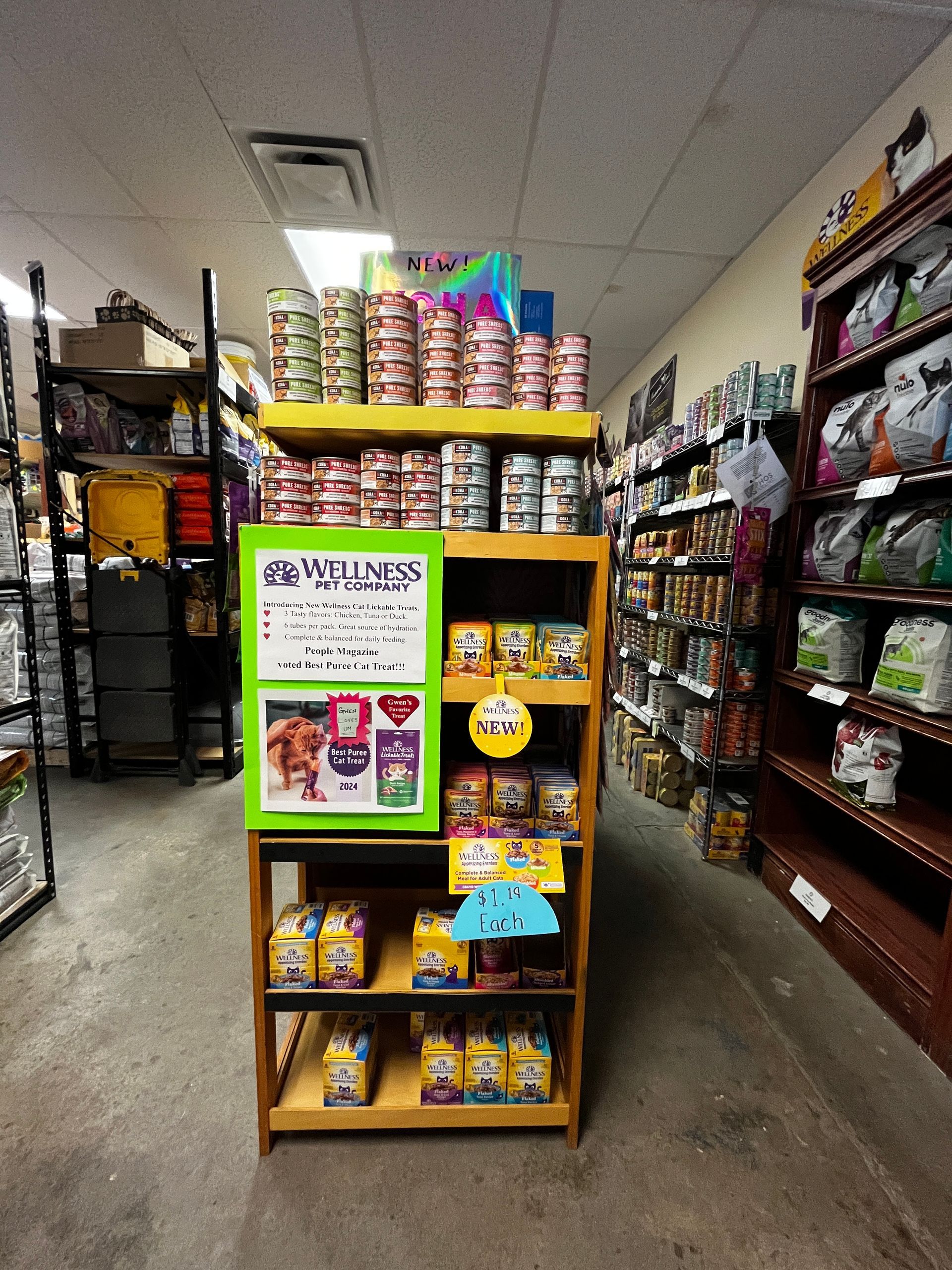 A shelf in a store with a sign that says wellness