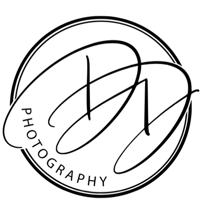 A black and white logo for a photography company.