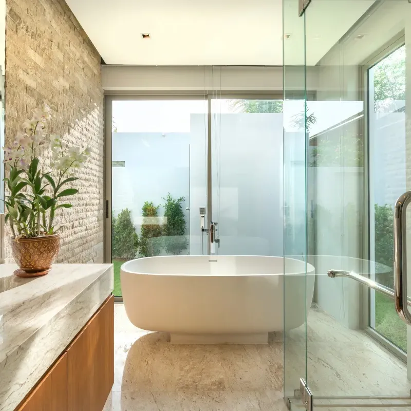 RSG Custom Builds bathroom remodel in Seattle, WA with a tub and a sliding glass shower door. Ideas and inspiration.