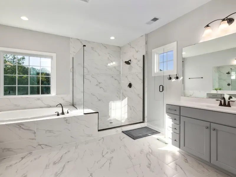 RSG Custom Builds bathroom remodel and installation in Seattle, WA with a tub, sink, and shower. Ideas and inspiration.