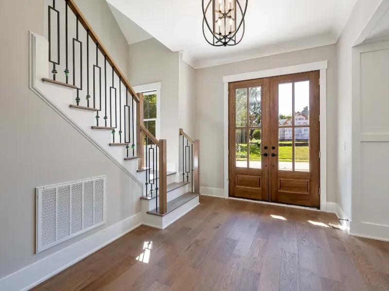 RSG Custom Builds hallway remodel and installation in Seattle, WA with stairs and a door in a house. Ideas and inspiration.