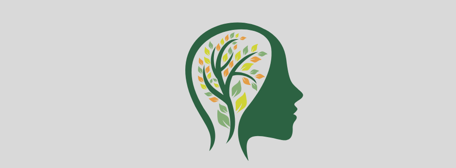 A silhouette of a woman 's head with a tree inside of it.