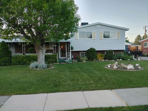 A House With A Large Lawn And A Tree In Front Of It - Salt Lake City, UT — Green Lawns Matter, LLC