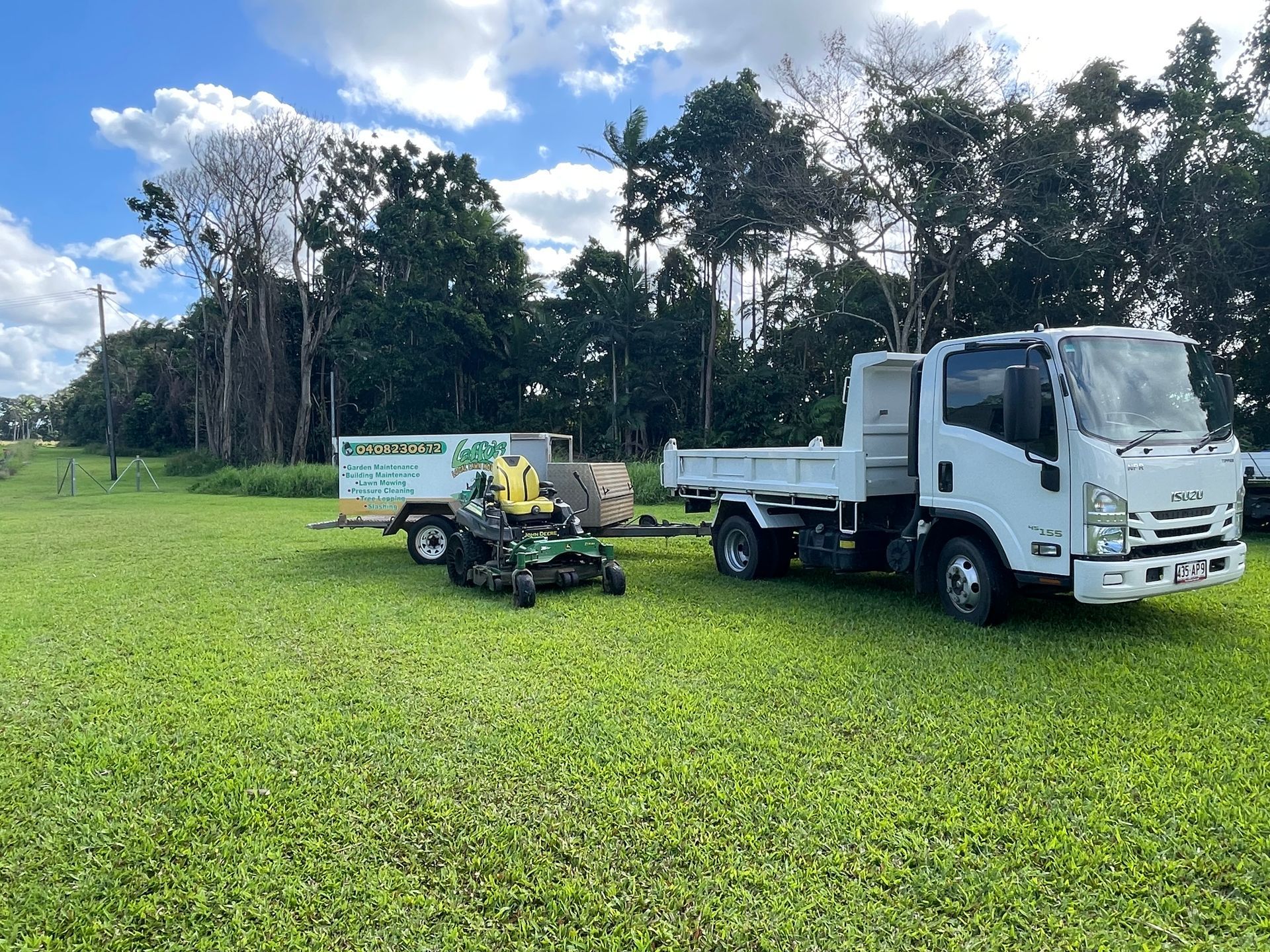 truck and Lawn Mower In Yard — Gardeners in Innisfail, QLD