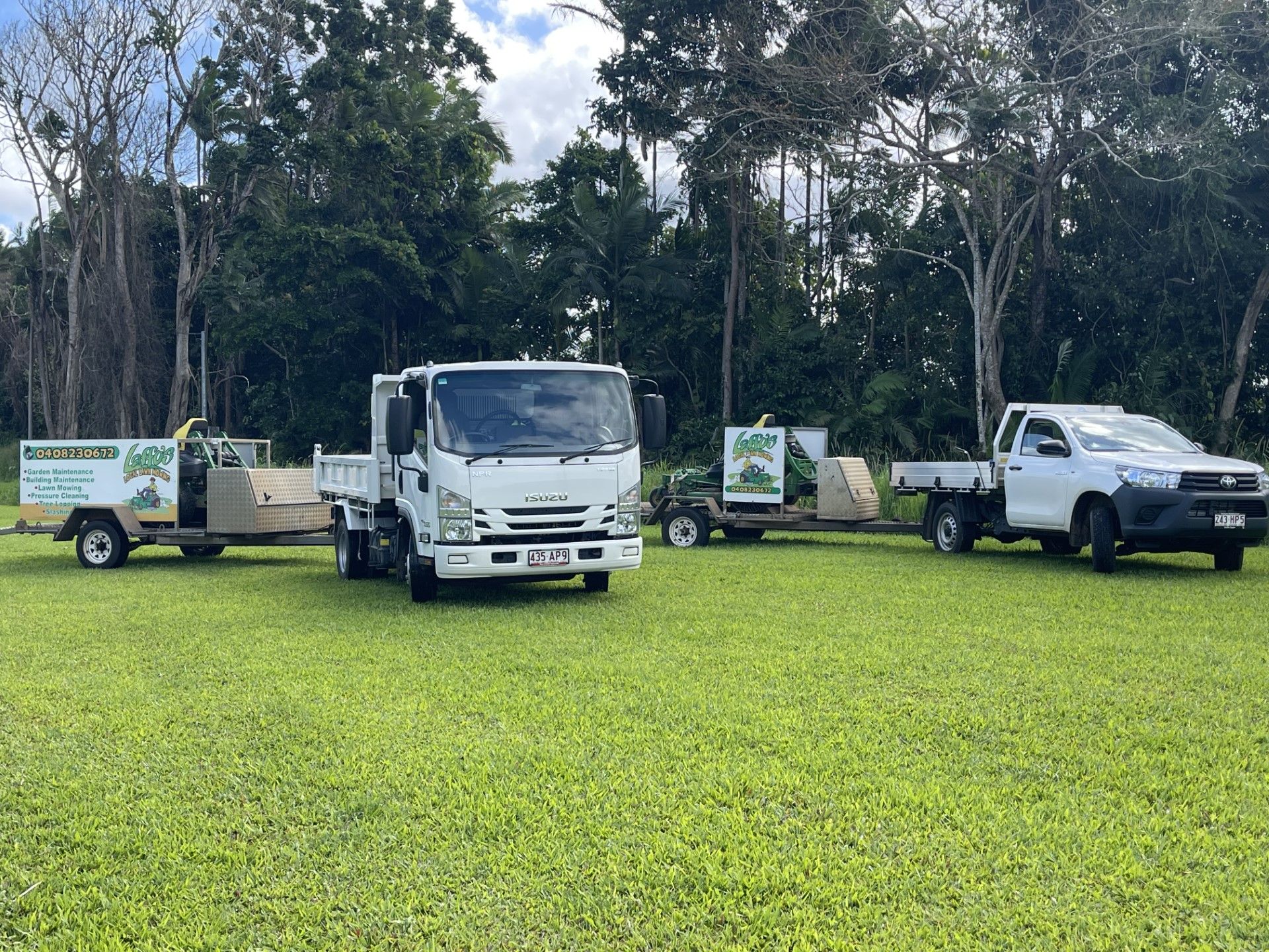 Trucks for Professional Gardener Mowing the Grass — Gardeners in Innisfail, QLD