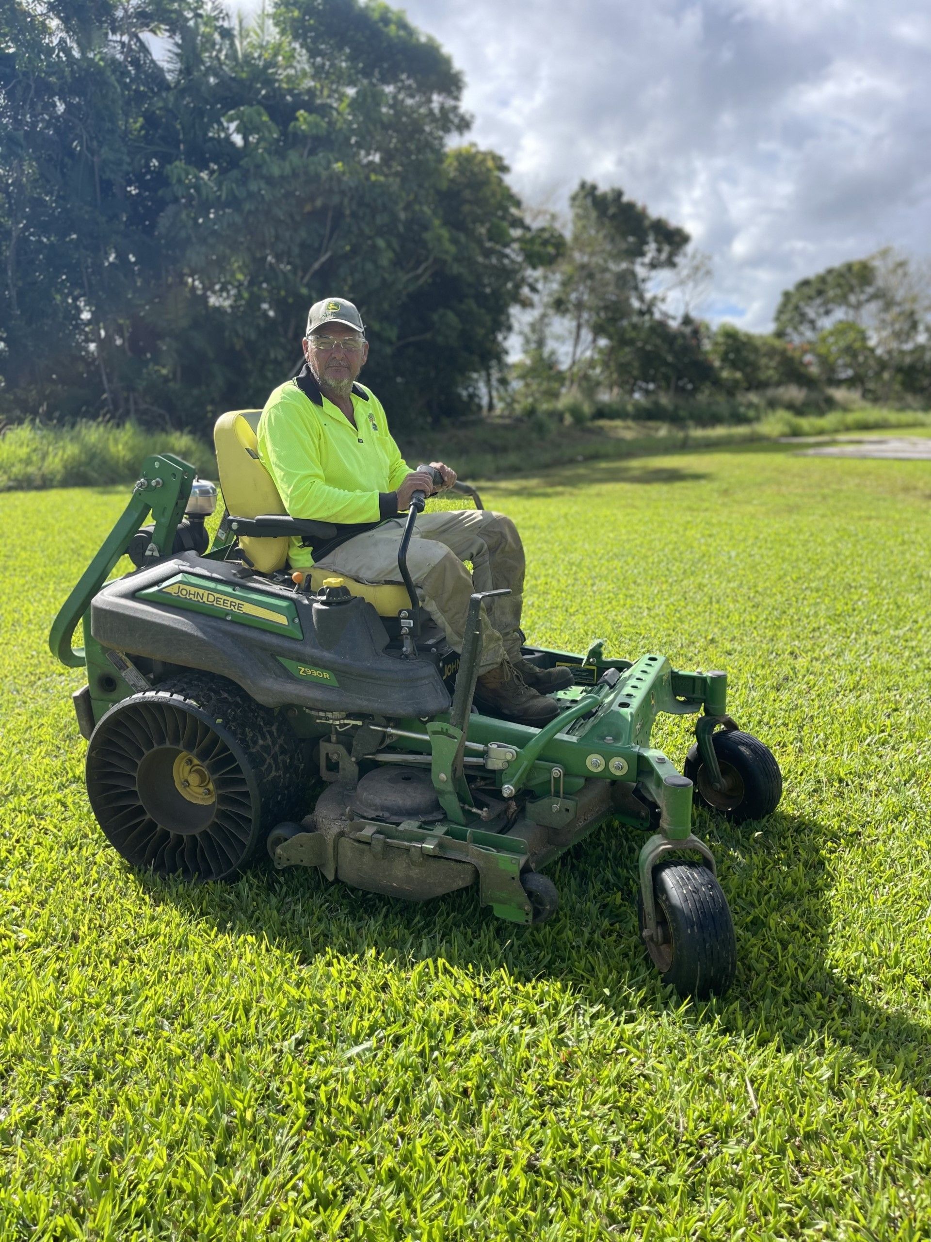 Landscape Gardener Using a Ride On Mower — Gardeners in Innisfail, QLD