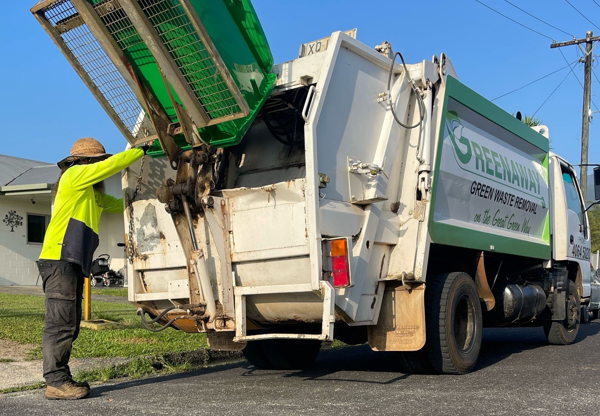 Professional Gardener Operating a Ride On Mower — Gardeners in Cardwell, QLD