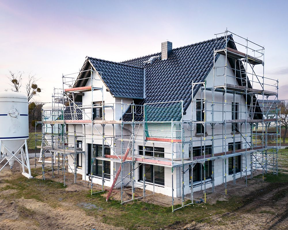 House is Being Built with Scaffolding Around