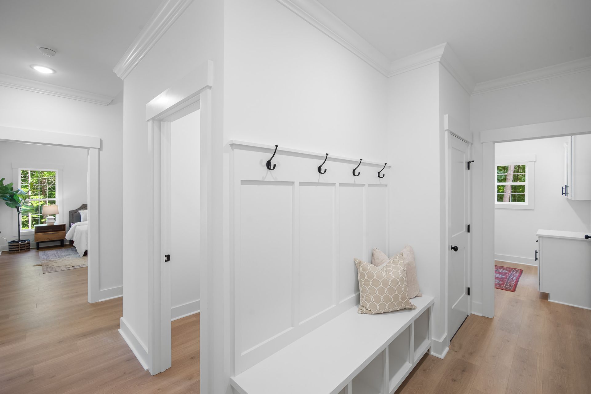 There is a bench in the middle of the hallway.