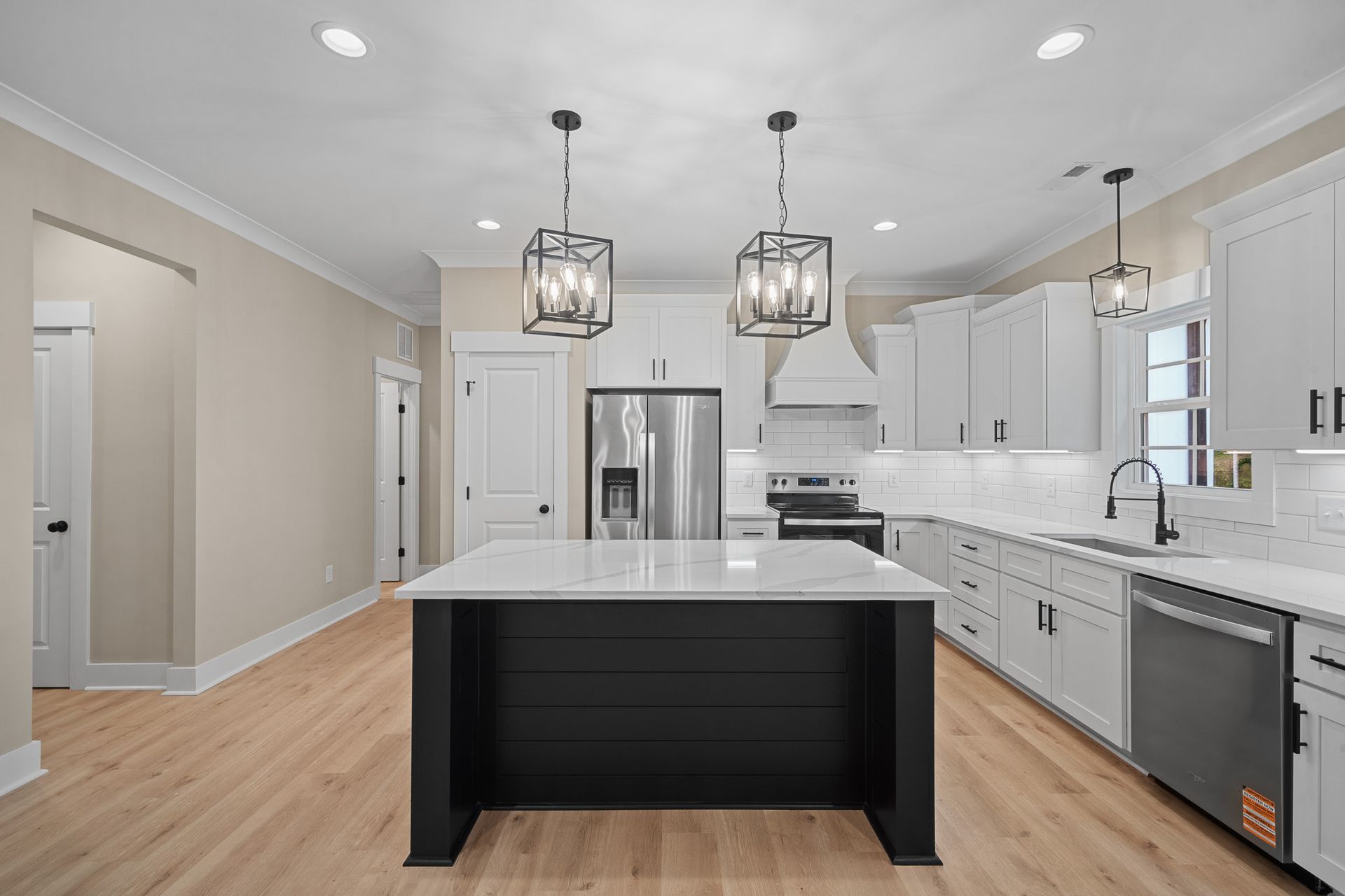 There is a large island in the middle of the kitchen.