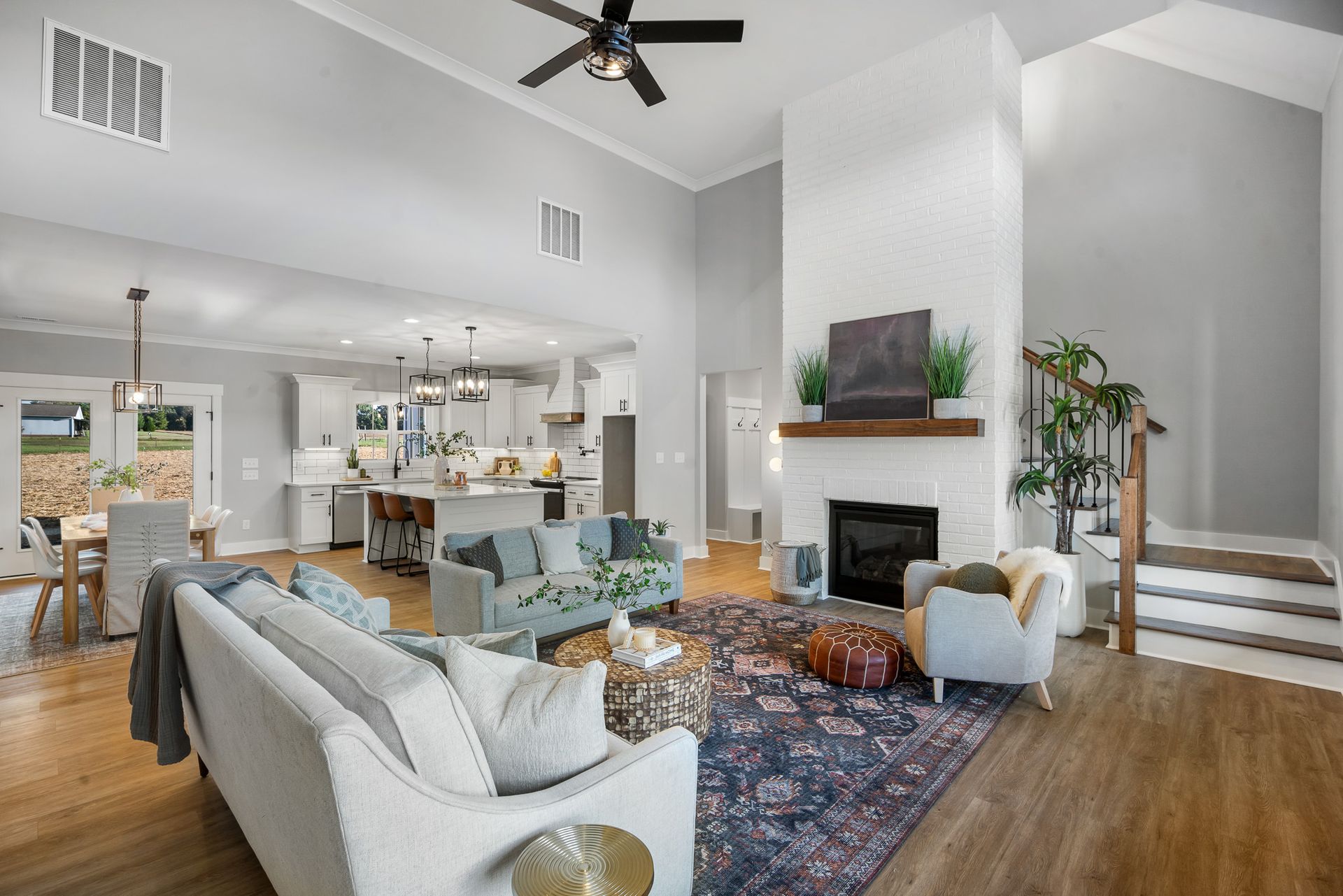 A living room filled with furniture and a fireplace.