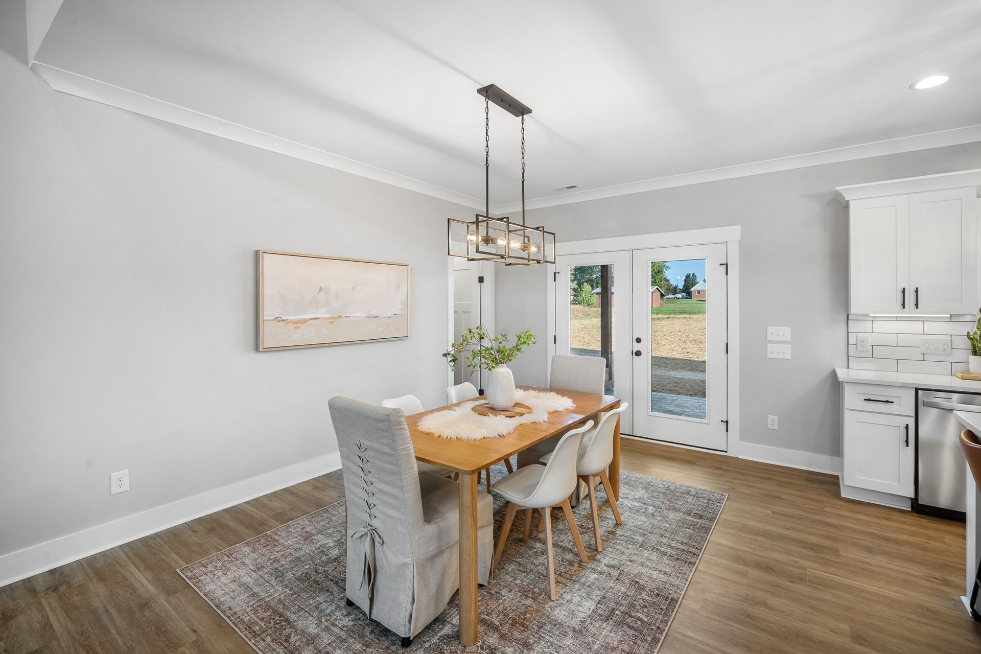 A dining room with a table and chairs in a house.
