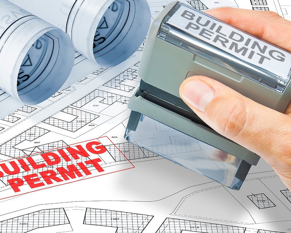 Man Stamping Building Permit