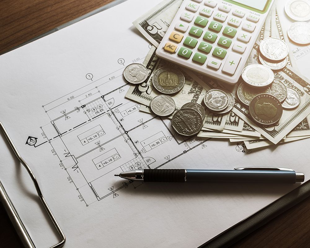 Calculator and Money on a Blueprint