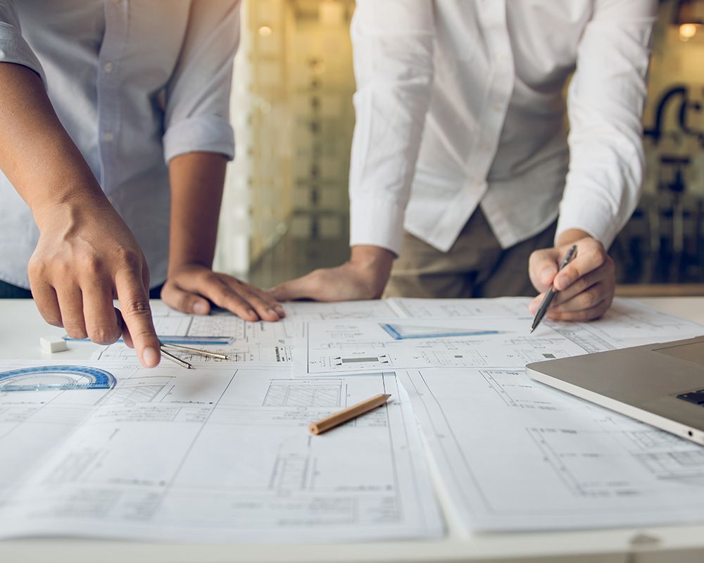 Worker Looking at a Blueprint