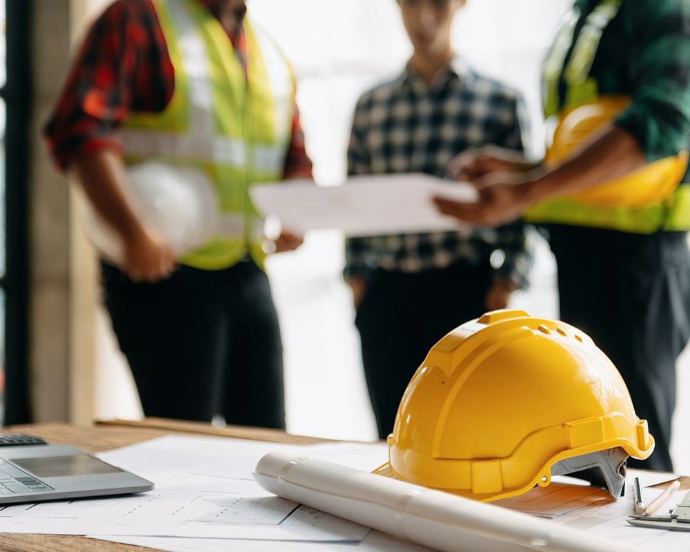Workers Discussing About Safety Standards