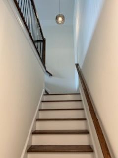 A set of stairs leading up to the second floor of a house.