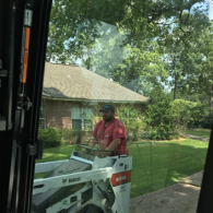 caldwell tree service employee driving equipment