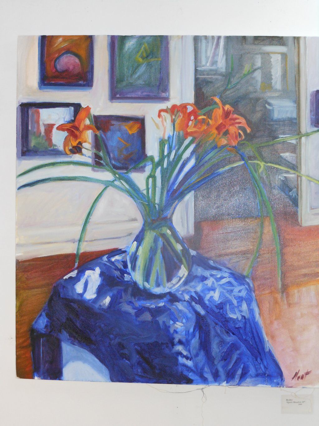 A painting of flowers in a vase on a table