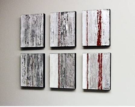 Six square paintings are hanging on a white wall.