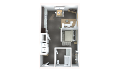 Floor plan of a studio apartment, featuring a bed, kitchenette, seating area, and bathroom.
