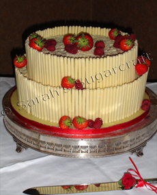 A white chocolate and strawberry cake.
