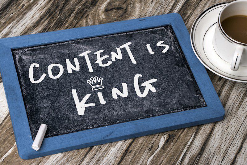 A chalkboard with the words content is king written on it