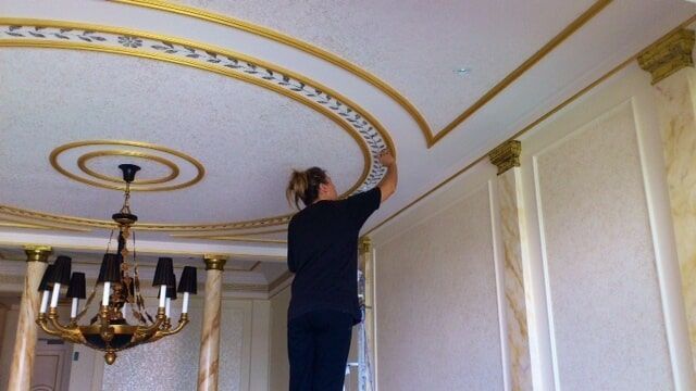 Woman Painting The Ceiling — Artizans International Specialised Paint Finishes in Robina, QLD