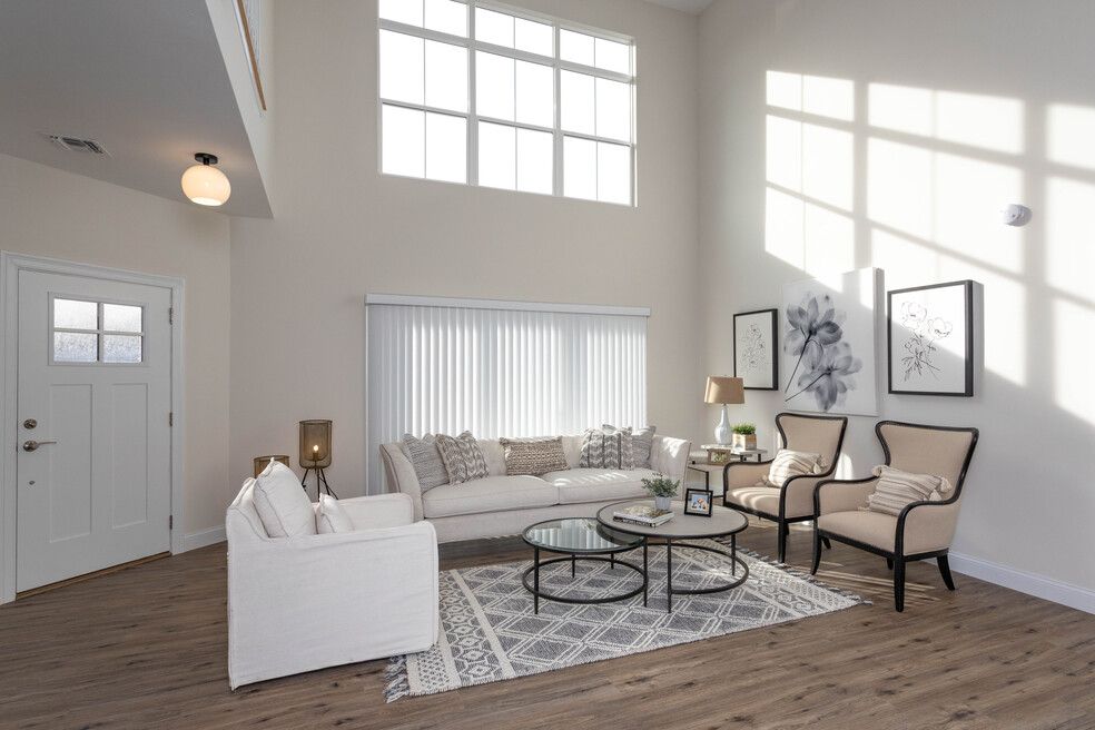 The Setauket -Living room with Sofa and large windows
