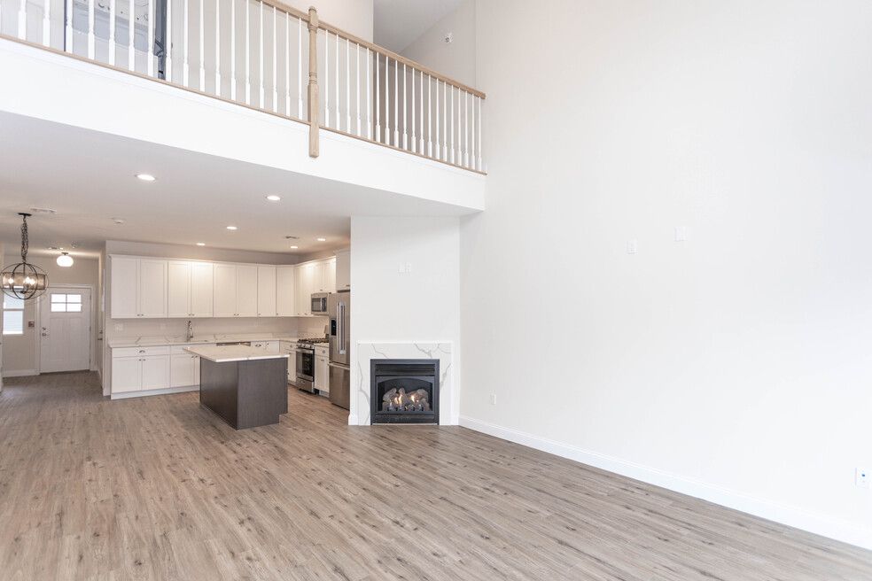 The Port Jefferson Unfurnished living room with fire place